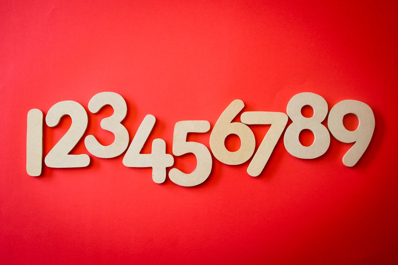 why-choose-us-img Creative display of numbers one to nine on a vibrant red background, ideal for educational materials.